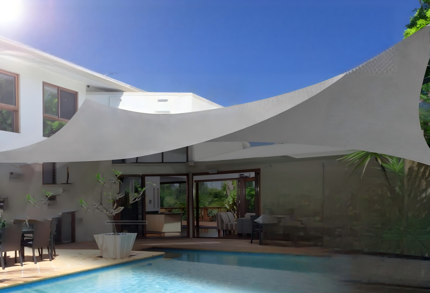Large sunshade canopy tent structure with blue fabric covering, aluminum frame poles, set up in outdoor grassy area